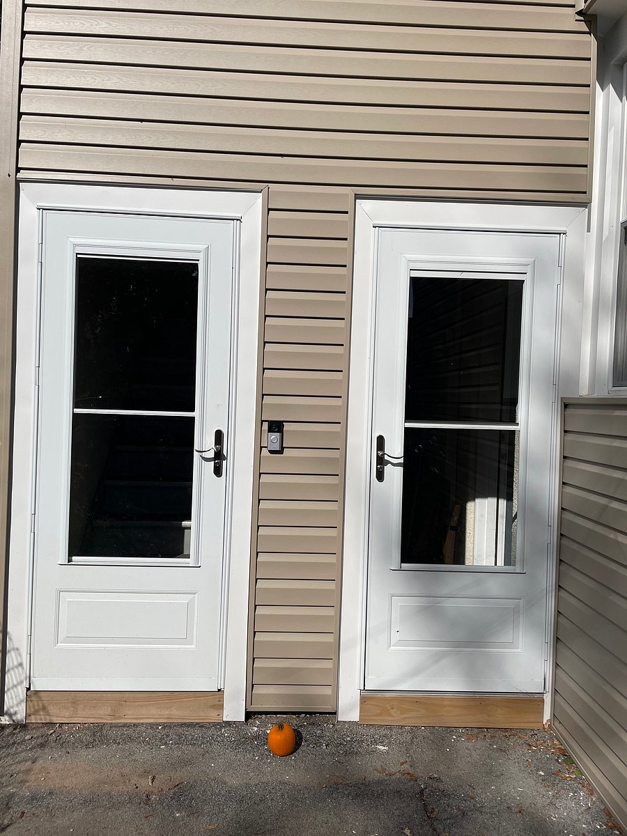 Entry door to the left, is in back of house and has Ring doorbell for added security.