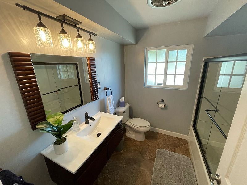 Guest bathroom has a tub/shower combo