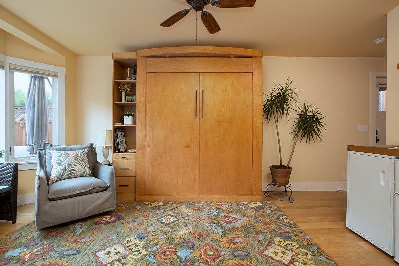Beautiful wall bed pulls down or can be left up for additional space