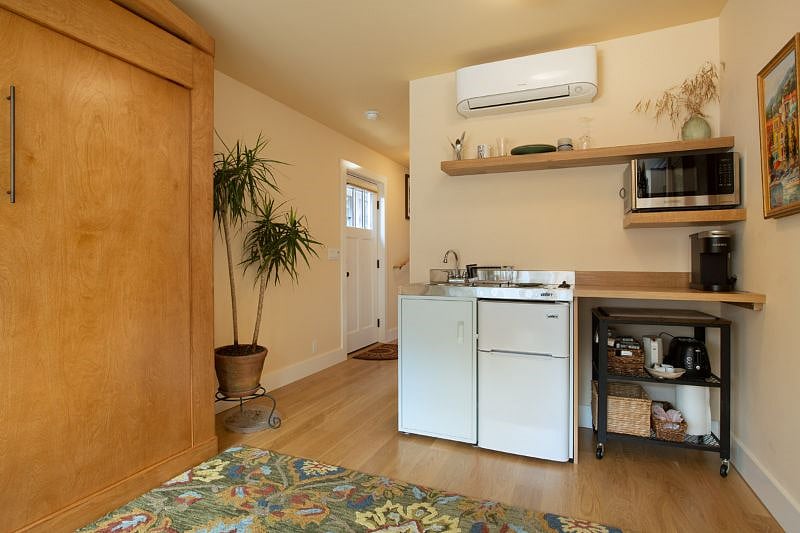 2 burner stove, sink, refrigerator/freezer, toaster oven, microwave, plates/utensils and more