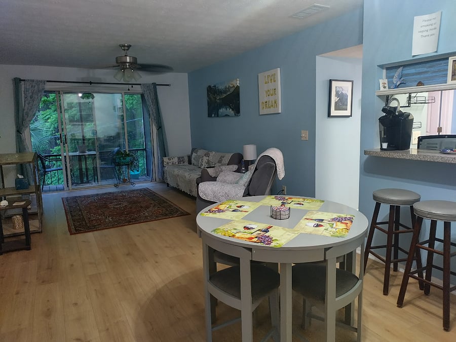 Dining, couch, and view outside in back