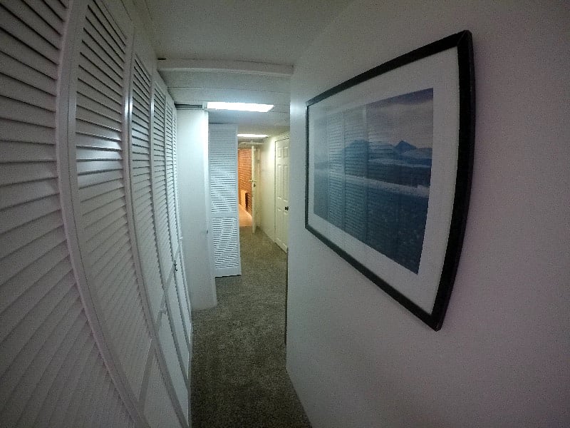 There is a long hallway, this is looking towards the kitchen, the washer dryer to the left, the work nook to the right.