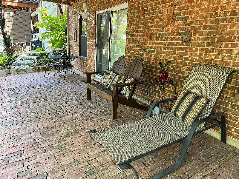 Covered patio overlooking backyard and natural area.  Apartment entrance through sliding doors.