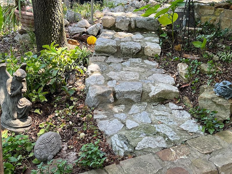 Stone stairway to patio entrance.
