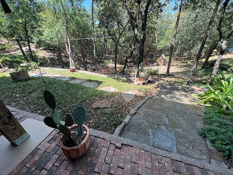 View from patio to yard and lower natural area.