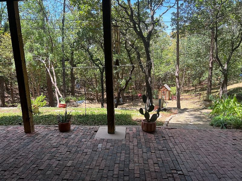 View from patio to backyard and natural area.
