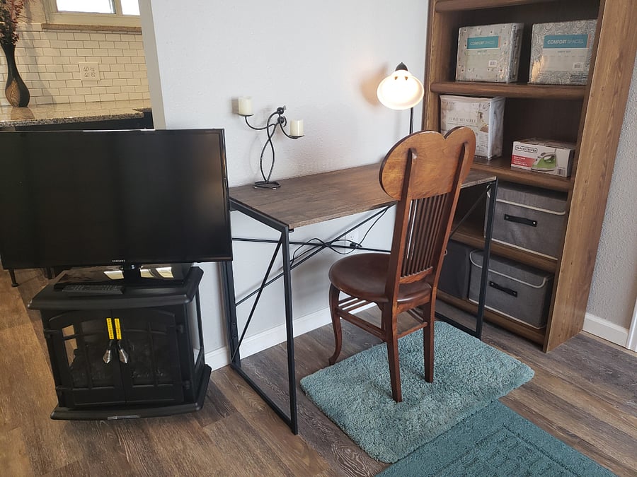 Desk and book shelves by bed