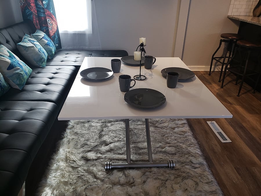 Coffee table folds out to become a dining table