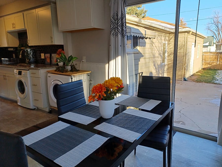 Kitchen with sliding patio doors and backyard