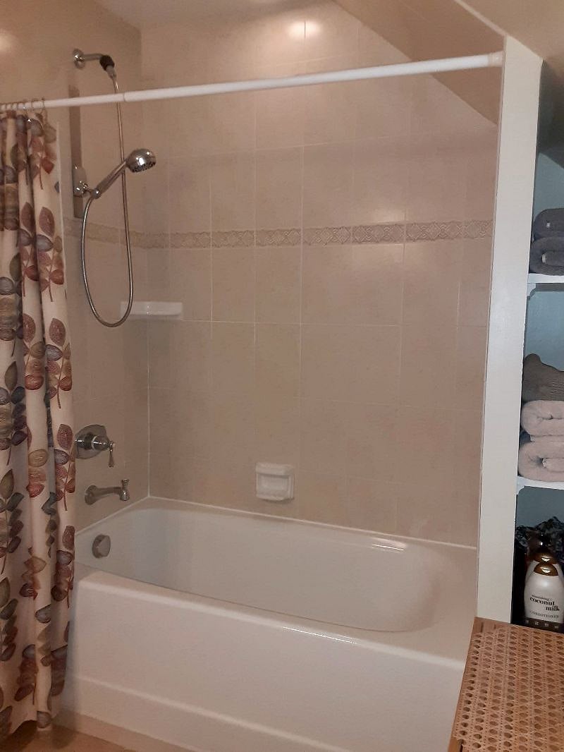 Deep Tub and hand-held option showerhead.  Good water pressure