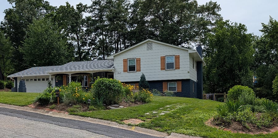 Front of house. Walkway around to back for tenant entrance.