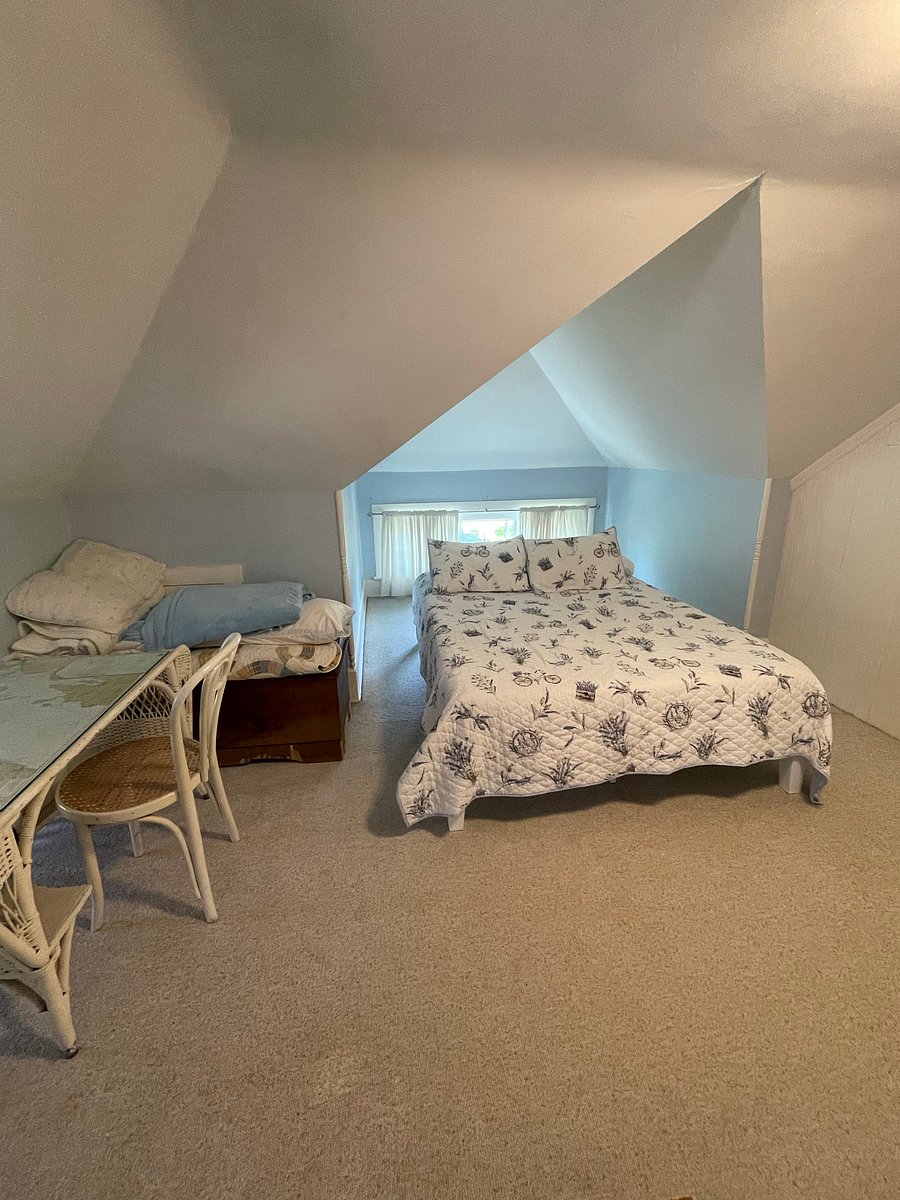 Loft bedroom with queen bed is spacious, has room for a floor mattress and its own private bathroom with a tub but no shower.