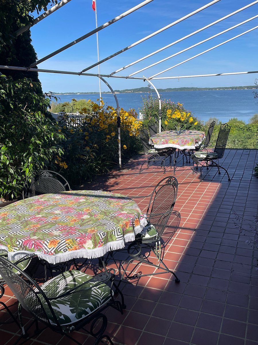 Two tables on the terrace make room to seat 10 people. Great westerly views anytime of the day. We see freighters, the Lake Express Ferry and many pleasure boats.