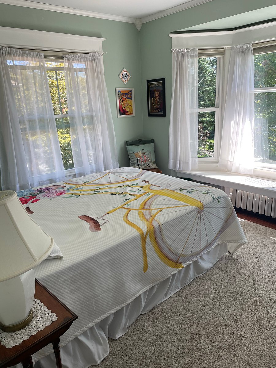 Bicycle bedroom with a queen bed and blackout shades, connects to the Jack and Jill bathroom.