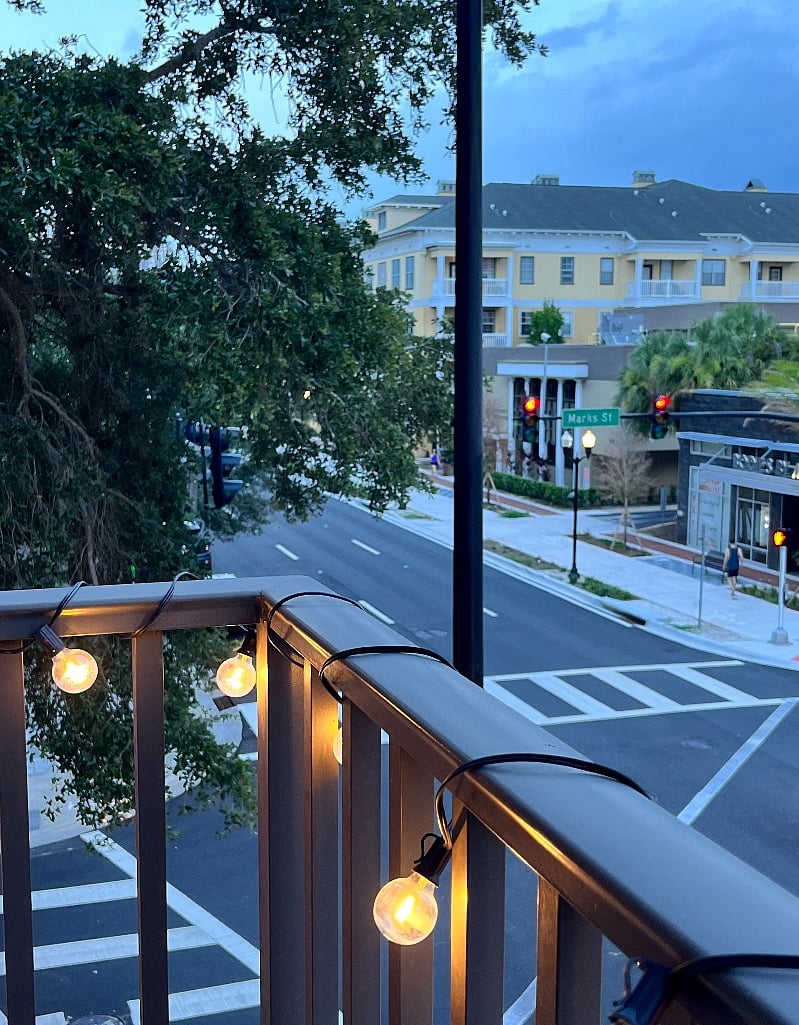 Small balcony view with lights for ambience. Also includes a screen To enjoy the fresh air without the worry of bugs.