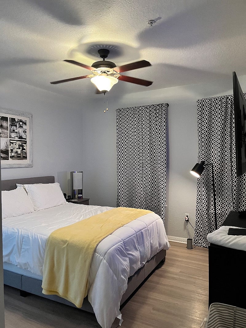 Master bedroom, has black out curtains. Large TV mounted on wall at end of bed with access to Netflix,Hulu and You Tube Tv.
