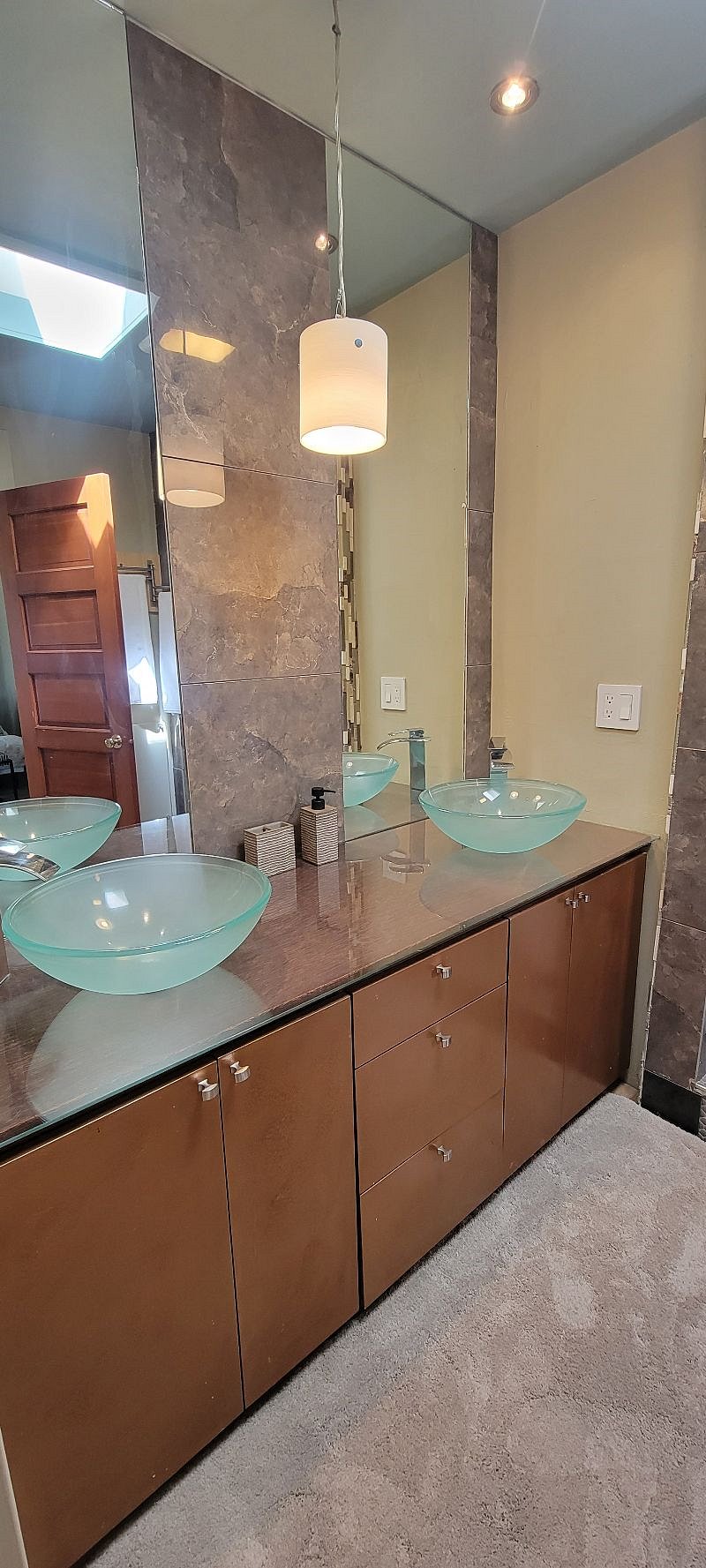 Double sink vanity with plenty of storage.