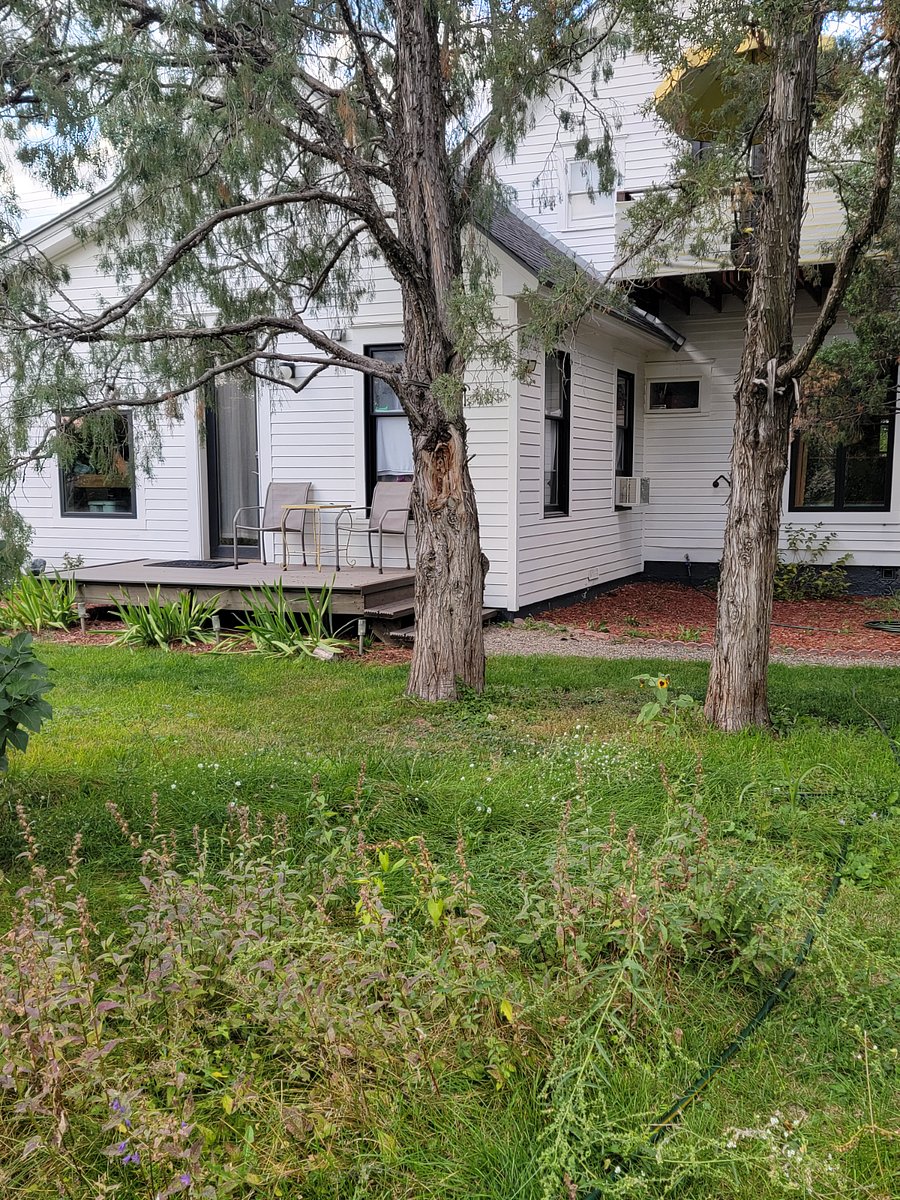 Main house sits back and to the right from the attached unit.