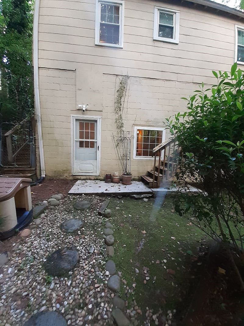 Private entrance is downstairs at he back of the home. Safety note: The black gutter at the bottom of the stairs. Please do not step on it.