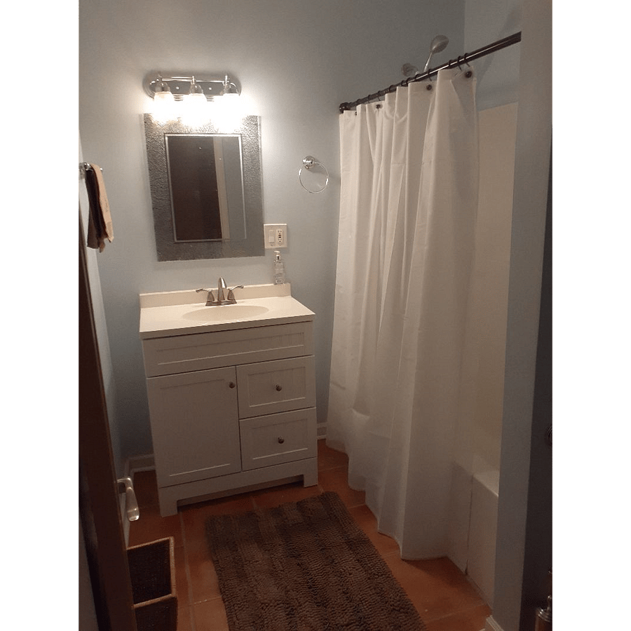 Full bath with combo tub/shower. Excellent vanity lighting for make-up or shaving.