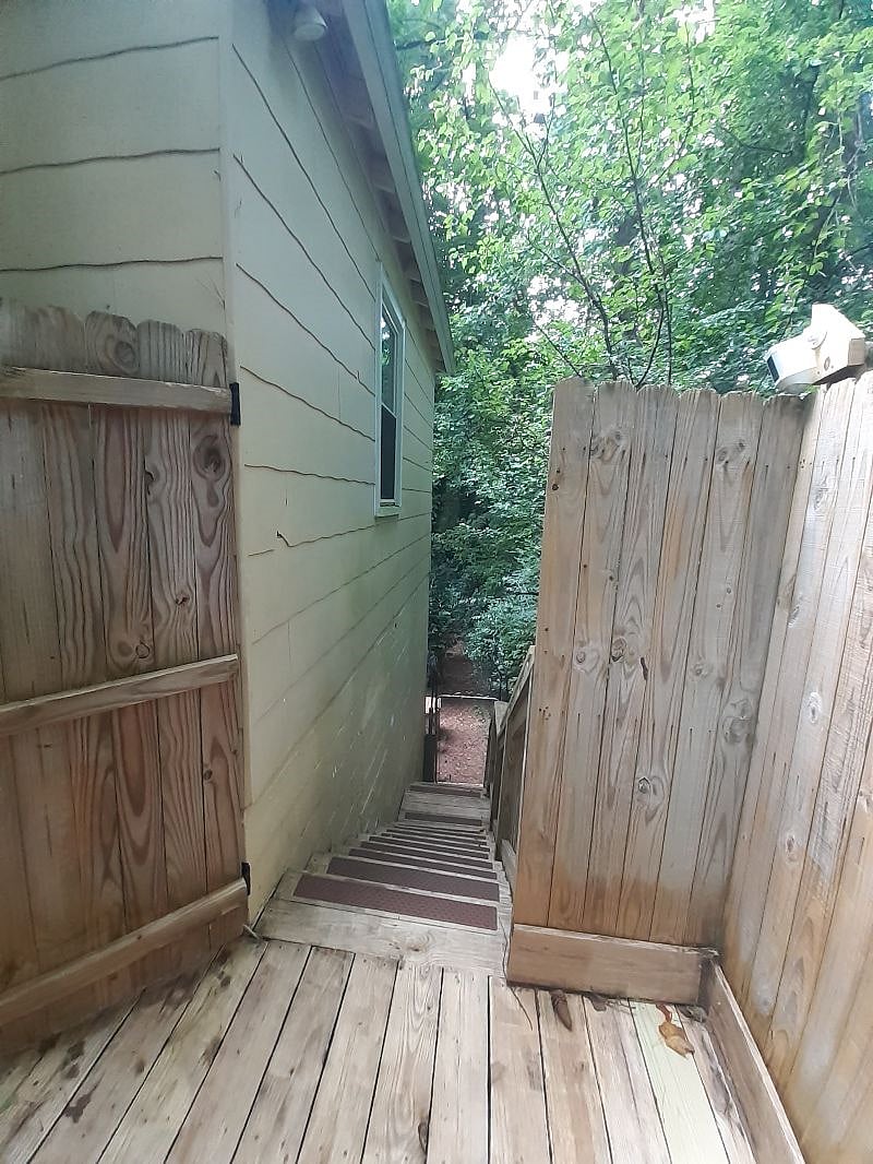 This is the entryway to the apartment private entrance. There are 2 non-private entries available for use, upon request, during inclement and colder weather. 

All stairs have safety: Treads. Handrails on railings. Gate latch w/ automatic closure.
