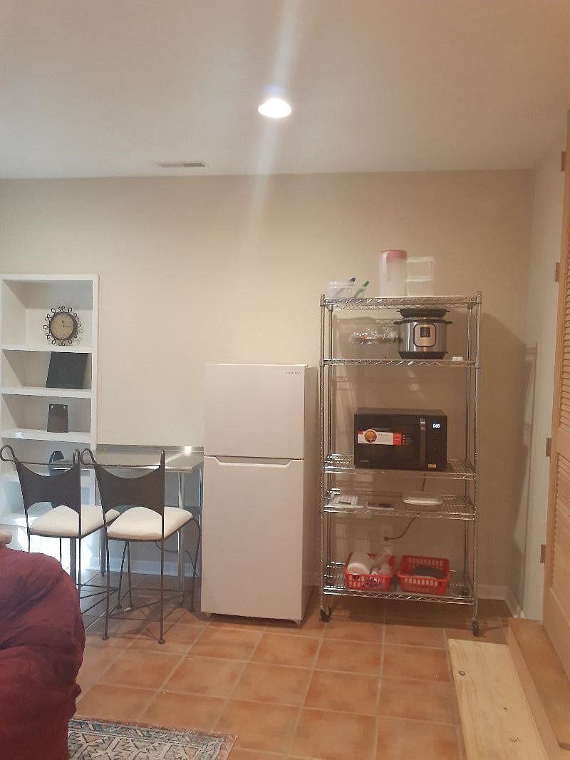 Insignia top freezer refrigerator, Instant Pot 6 in 1 pressure cooker, & giant cutting board for food preparation. 

