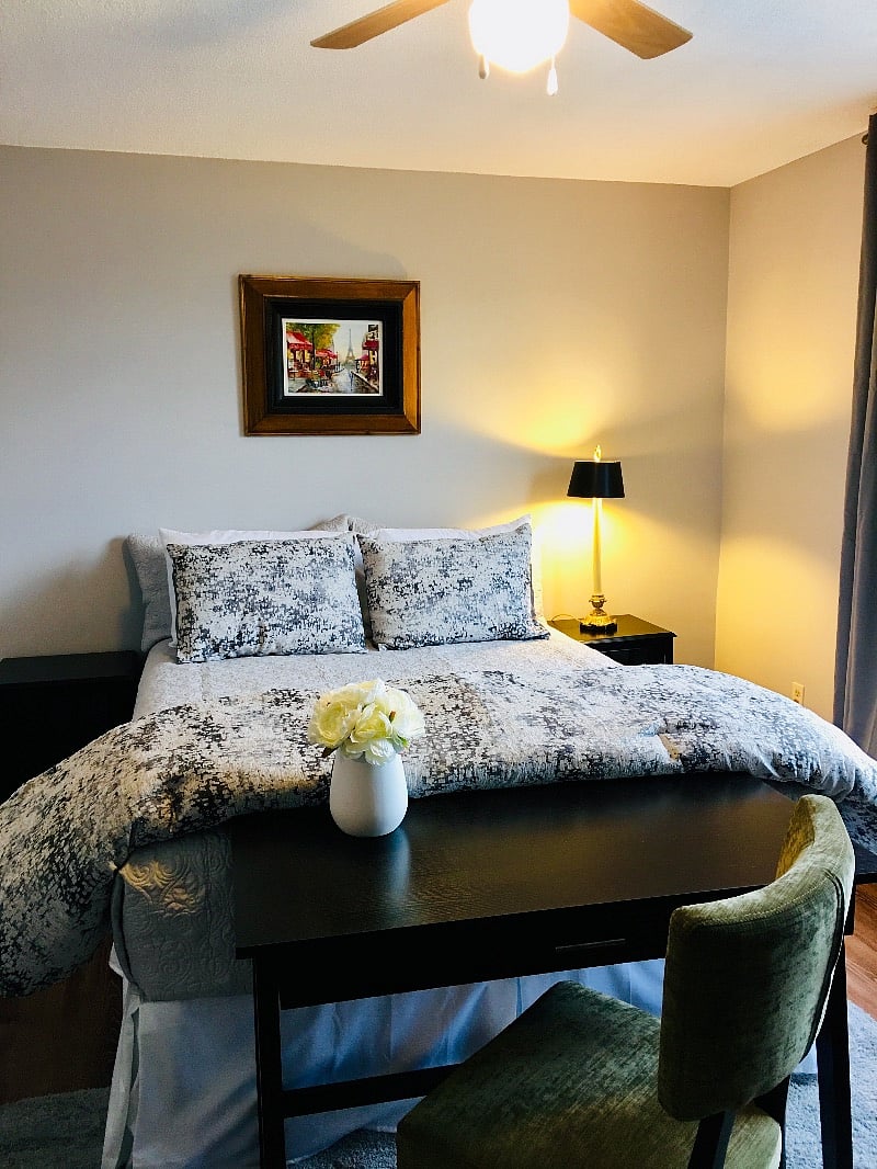 Master bedroom features queen size bed and oversized walk-in closet.