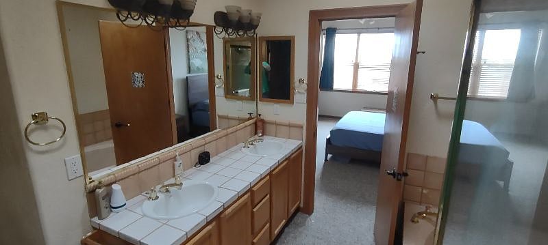 Master bedroom bathroom comes complete with dual sink