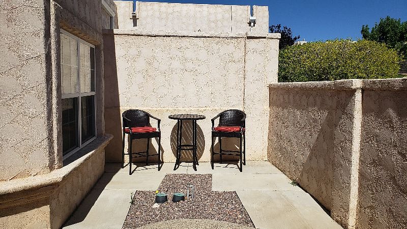 Enjoy watching the sunrise from this quaint entrance nook that faces the Sandias!