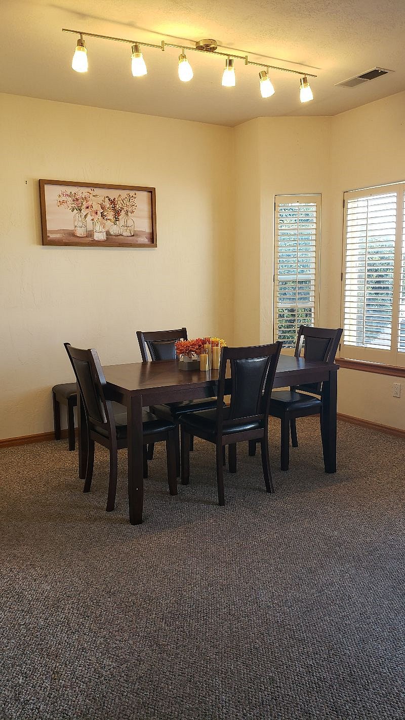 Brand new dining room set! Wonderful evening view of the west mesa and amazing sunsets!