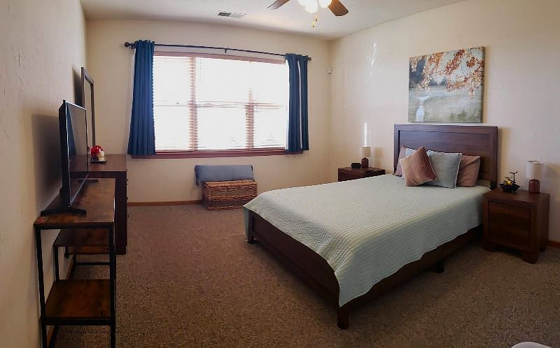 Spacious master bedroom has comfortable foam mattress and plenty of storage space