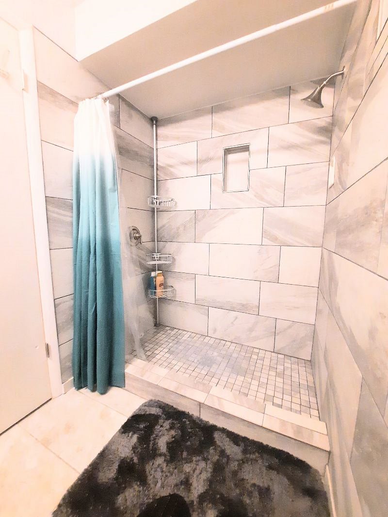 Tiled shower bathroom view
