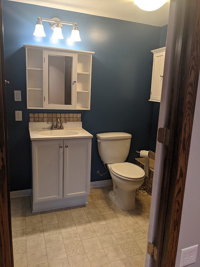 Bathroom Sink/storage, toilet, wall storage with towels included