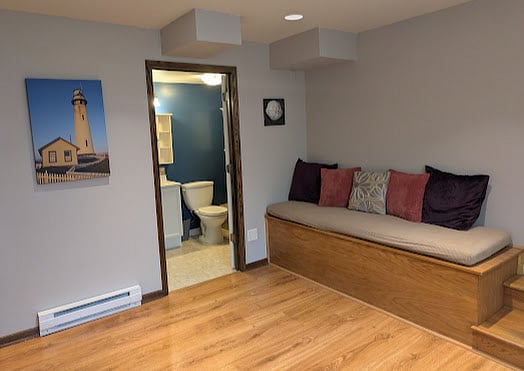 Greatroom with Bench and Bathroom entrance