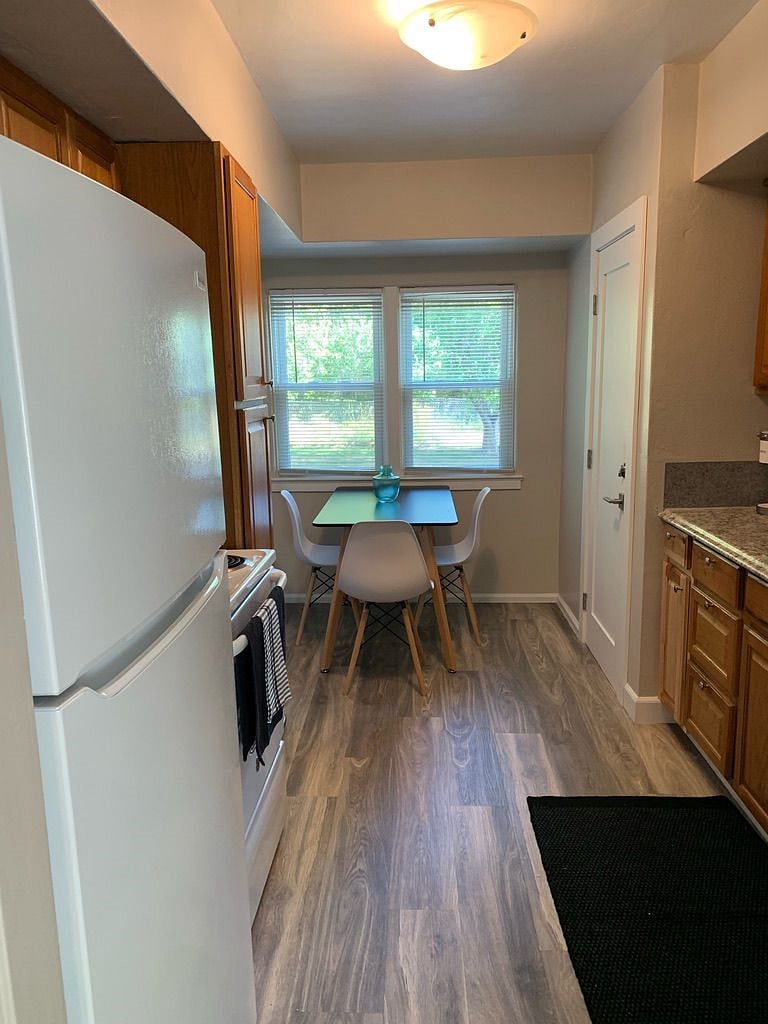 Galley kitchen with table to seat 4. Door on right is secure and goes to downstairs shared laundry area