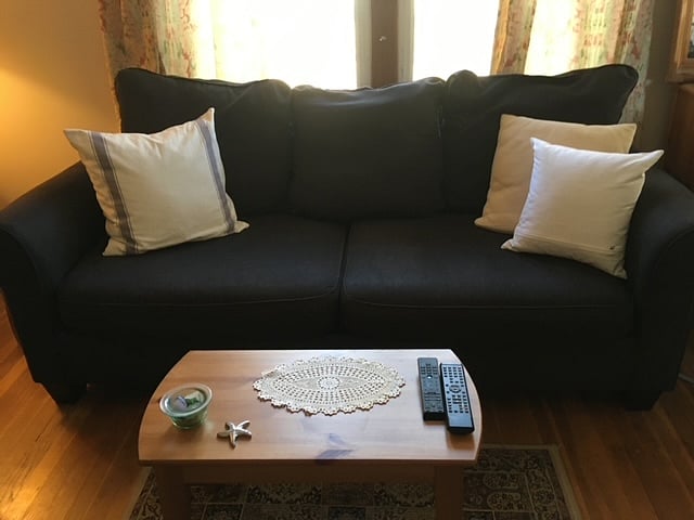 Living room with comfortable Loveseat for reading , relaxing and watching TV