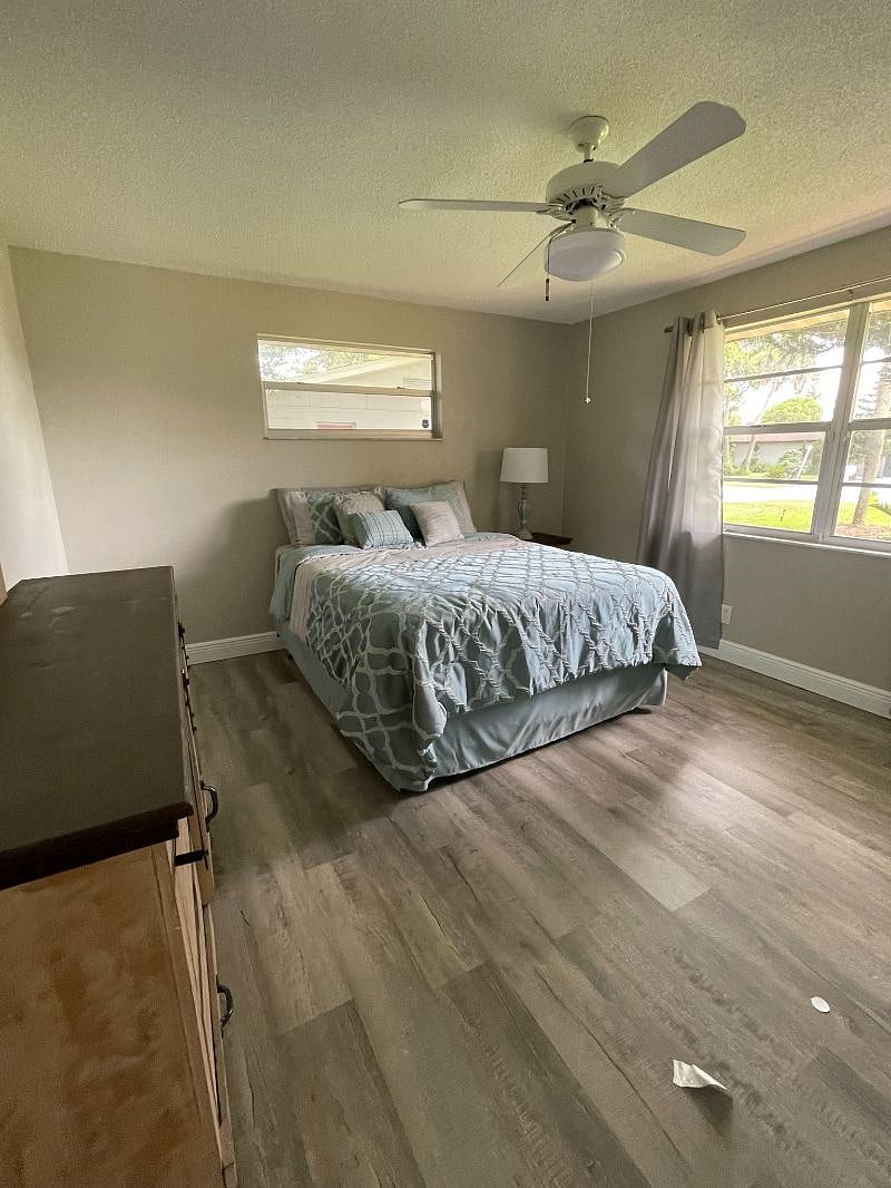 Large master suite with a private bathroom. Plenty of Florida sunshine and privacy curtains. Master also equipped with private workstation desk and chair. Larger smart TV. Queen size bed.
