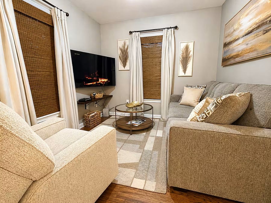 Unwind after work with comfortable seating, Smart TV, and a warm, relaxing atmosphere.