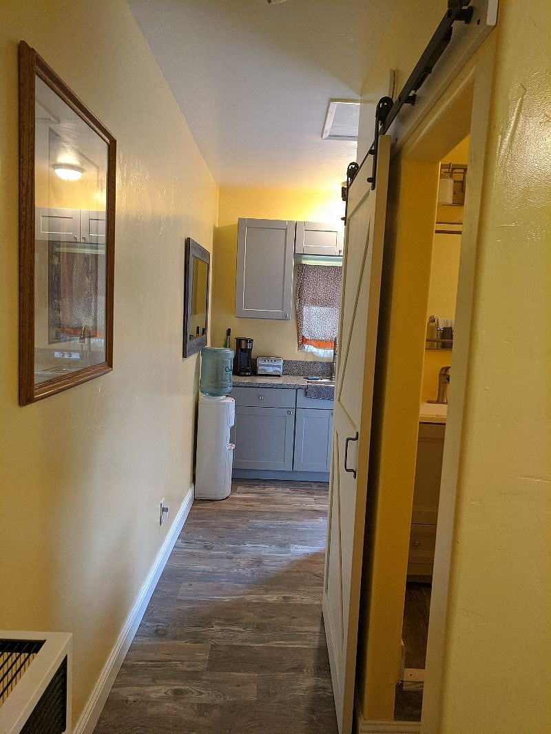View from bedroom back down hall to kitchen.