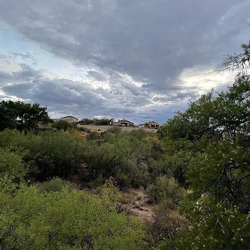 Quiet, peaceful view of wash and mountains from the covered deck.