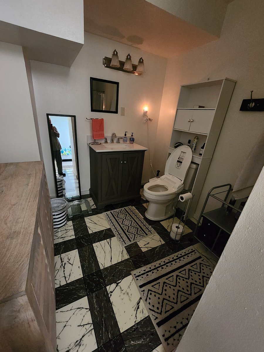 large bathroom with bidet on the toilet