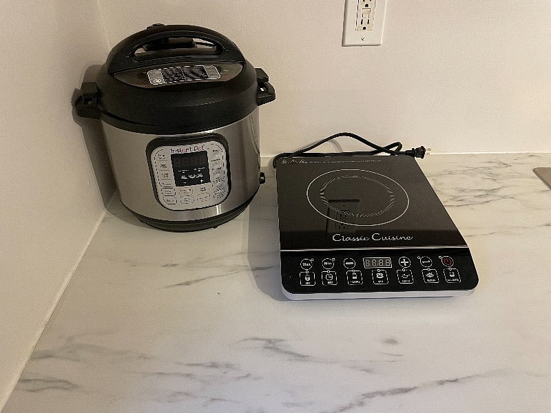 Instant pot and cook top (pots and pans and cooking utensils provided). All silverware, plates, bowls, cups etc provided.