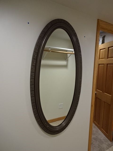 Mirror hung in walk in closet