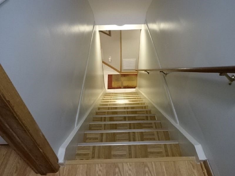 Stairs to basement. Entrance on east side of house