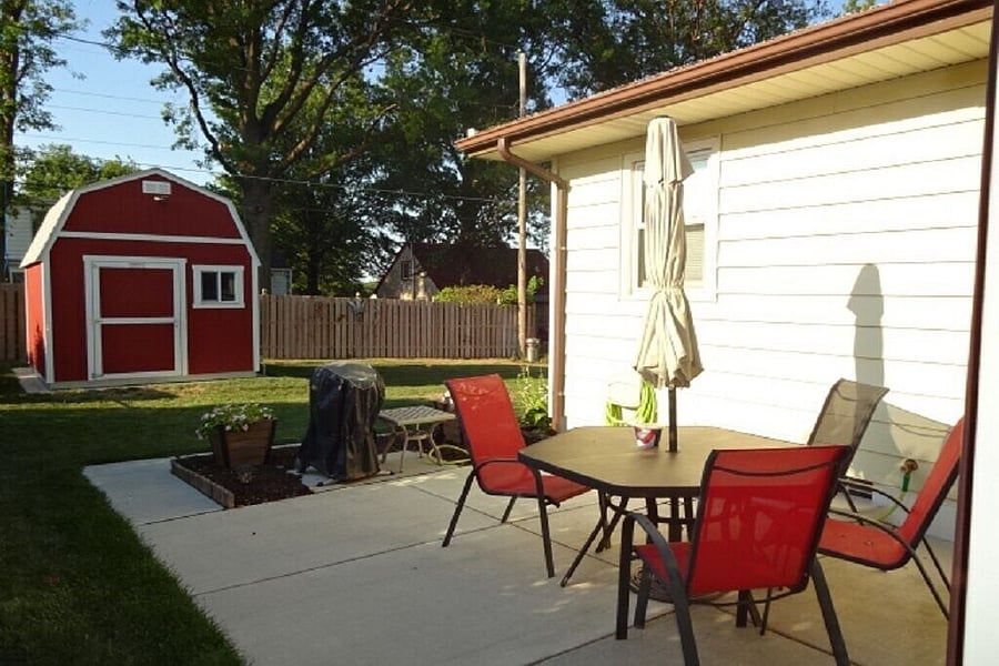Backyard with seating area and gas grill