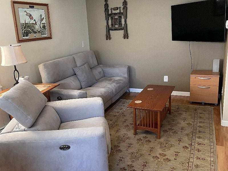 Living area with big screen TV with YouTube TV and Netflix