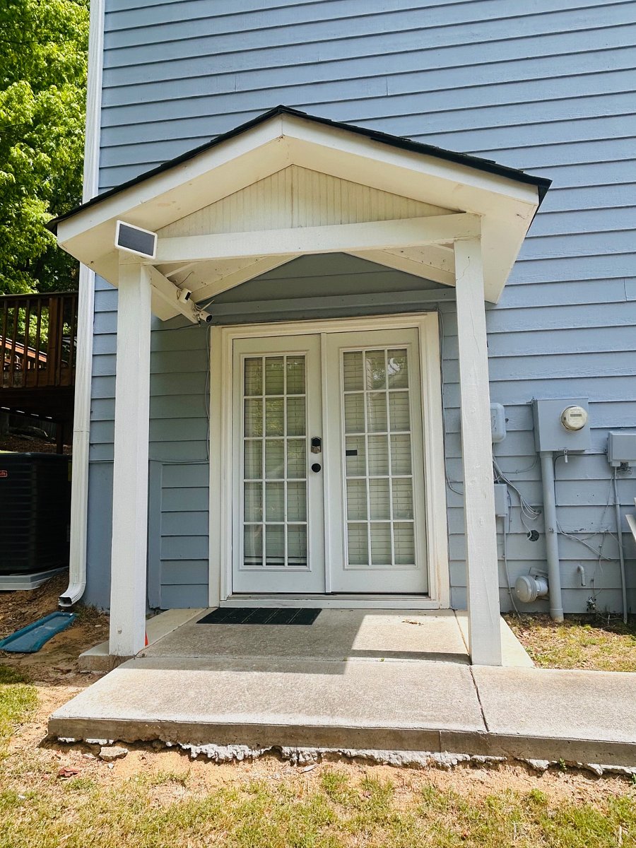 keyless entry to basement door with an overhang to keep rain from soaking you or your Amazon packages.