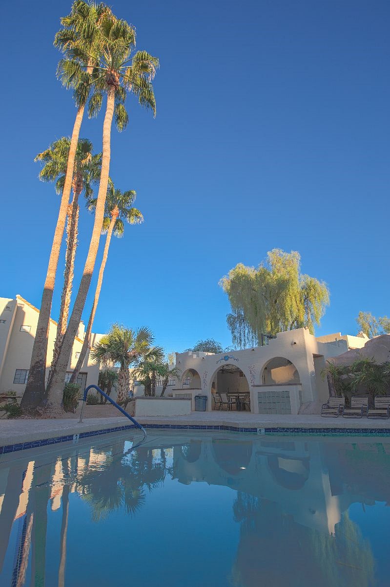 Club house with bbq and dining table by the swimming pool