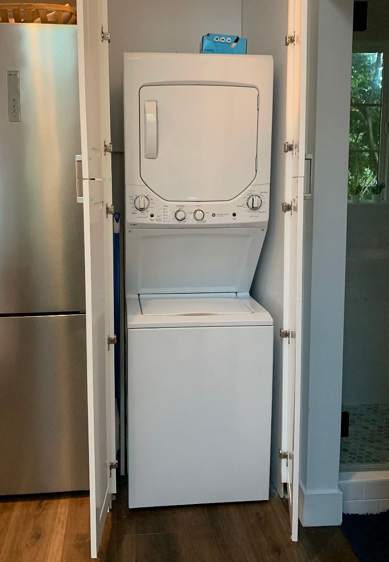 Stacking washer dryer in unit