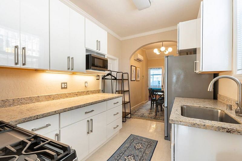 Sunny full kitchen for simple meal prep or creating full meals. 